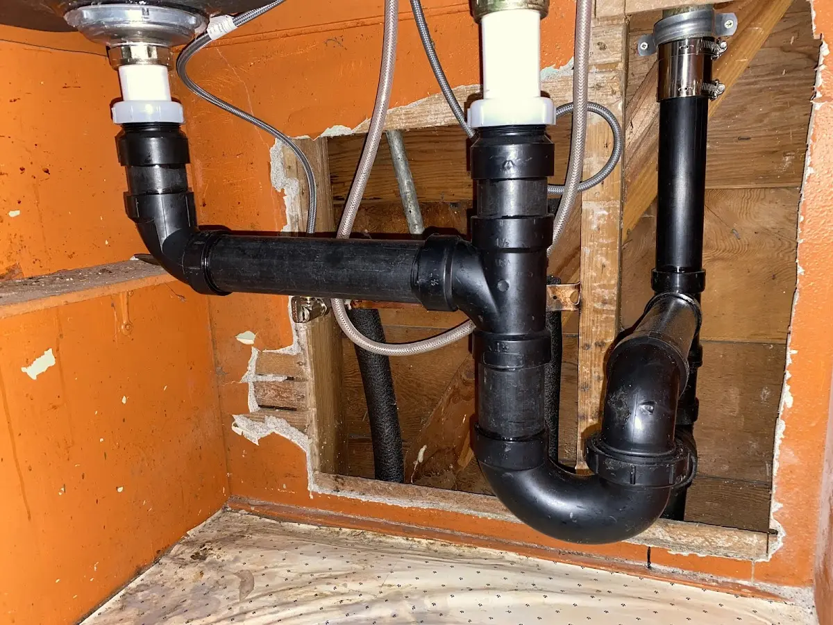 Professional Garbage Disposal Repair equipment and tools on the job in Inverness